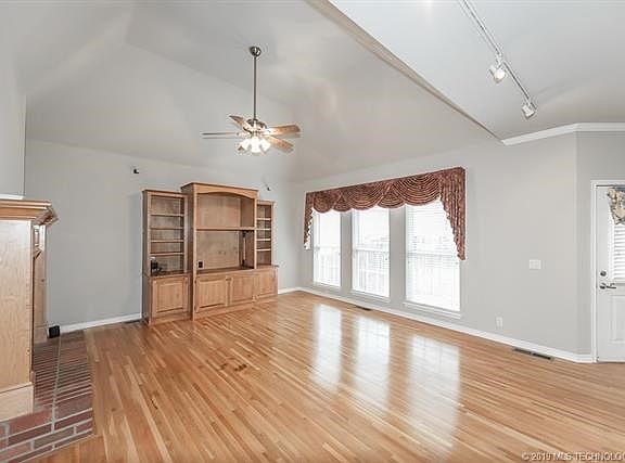 Great room off kitchen with fireplace and solid wood floors