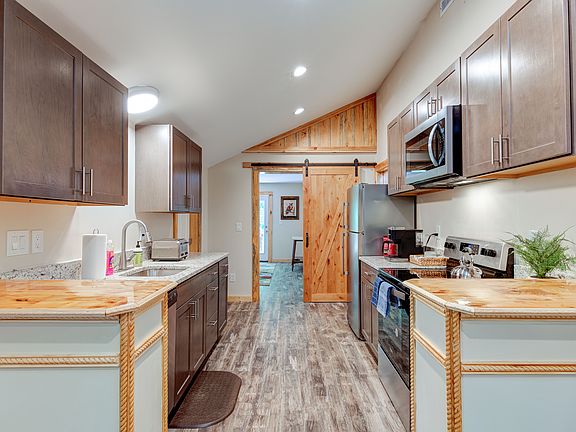 Galley Kitchen with new cabinets and appliances