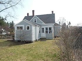 Back of house with sunroom