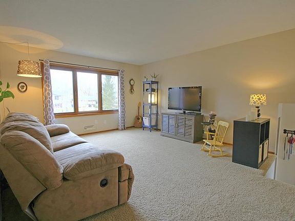 Neutral carpeting throughout.