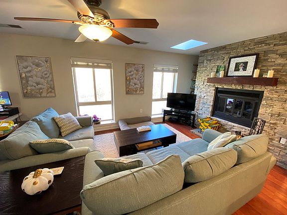Living room with wood-burning fireplace