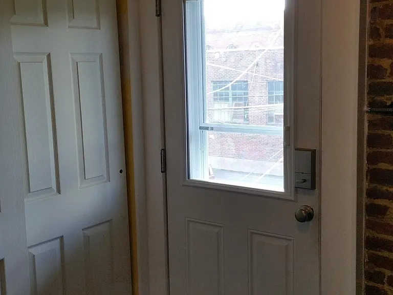 Back door and pantry. Apartment features a private direct entrance in the rear that goes into kitchen. The lock is a programmable code system - we clear out old codes and update with each tenant. Go Keyless with confidence!