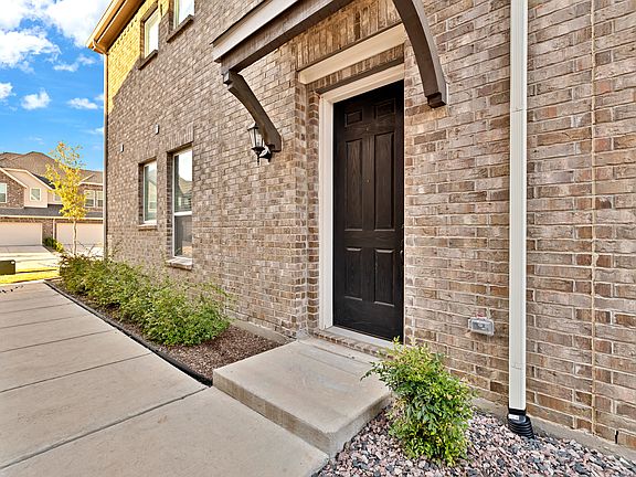 Walk way and entrance to the home from the side.