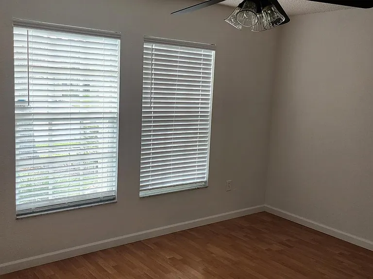 Larger bedroom with windows toward front of the house