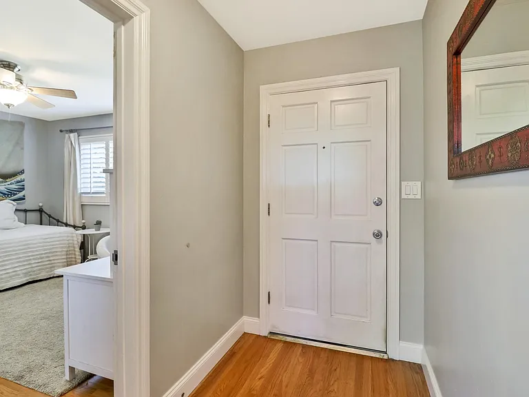 Front entryway, with third bedroom on left