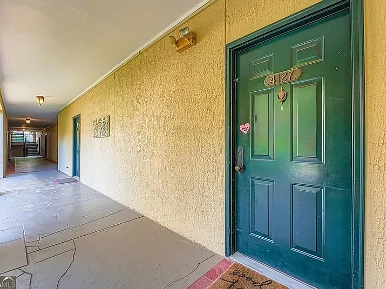 Secure, well-lit entrance is off the courtyard, but one floor up from the street.
