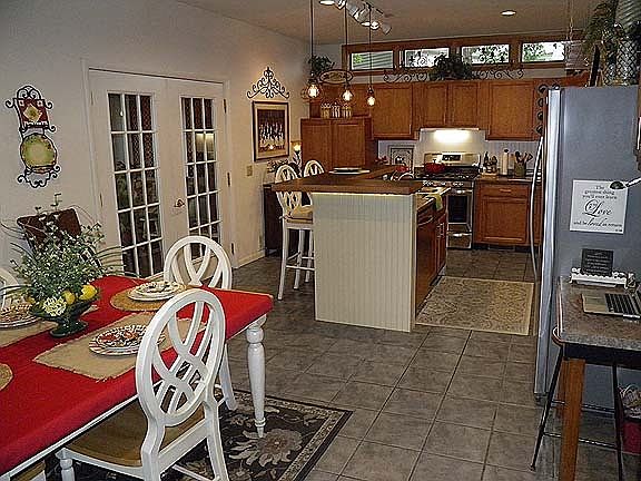 Kitchen w french doors to 3 season porch
