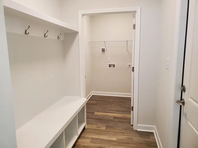 Mudroom off garage with laundry room