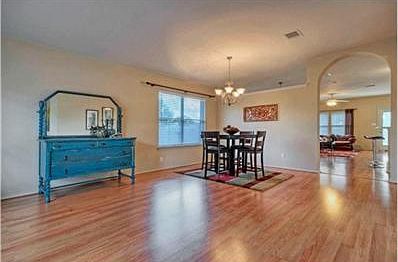 The formal dining area and living area are at the front of the h