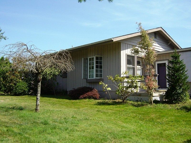Front entrance. Wonderful yard with fruit trees.