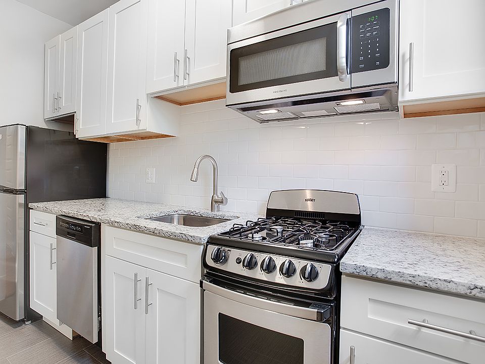 Renovated kitchen with granite countertops and stainless steel appliances