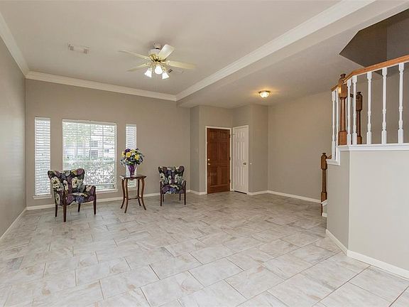 Stylish tile accent the formal living and dining room combination.