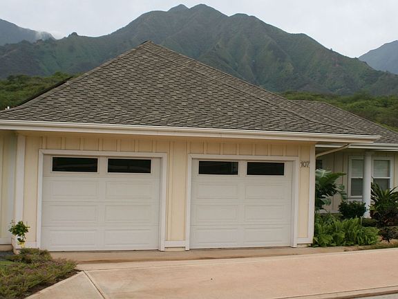 Double door/car garage w/ vaulted ceilings for added storage
