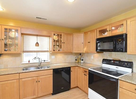 Updated appliances and tile back splash.