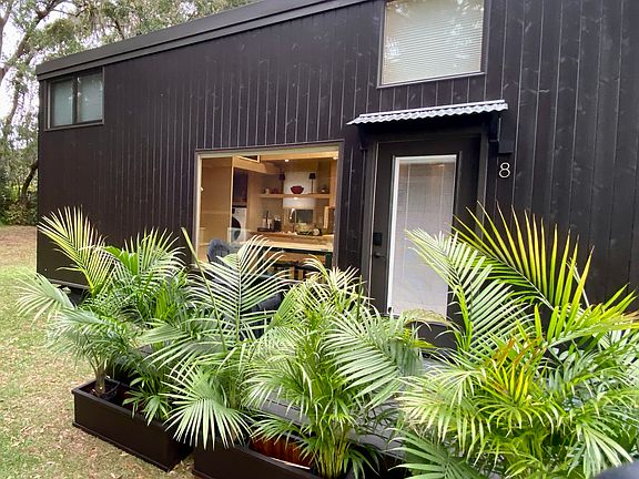 Escaperoo tiny home is (26' l x 8.5' w) with a (6' x 12') wooden deck.