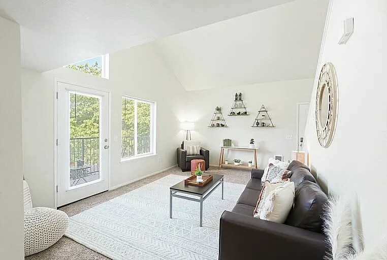 Embrace the light in this chic and airy living room, perfect for relaxation and gatherings.
