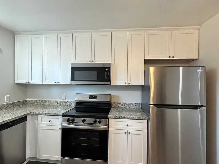 Remodeled Kitchen includes brand new appliance and newly installed cabinets. Unit includes dishwasher, garbage disposal, stove, microwave and full-size refrigerator