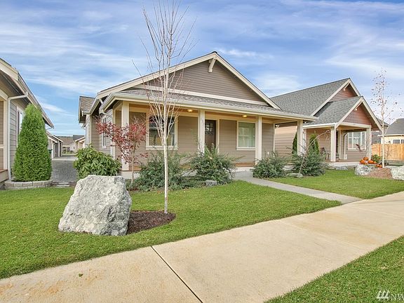 Beautifully landscaped and private front yard.