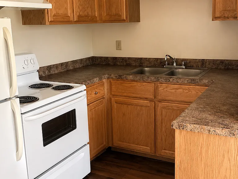 Kitchen Area - Appliance finishes, flooring, and countertop styles may vary by unit.
