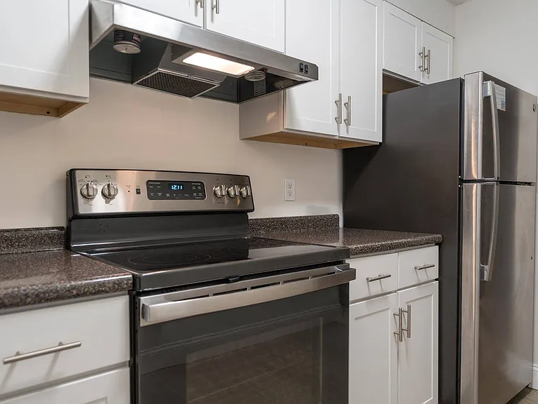 Modern kitchen style with updated white cabinetry and sleek stainless-steel appliances, creating a fresh, clean look.