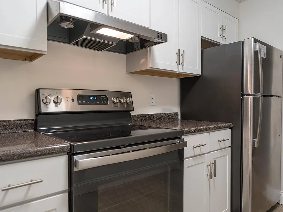 Modern kitchen style with updated white cabinetry and sleek stainless-steel appliances, creating a fresh, clean look.