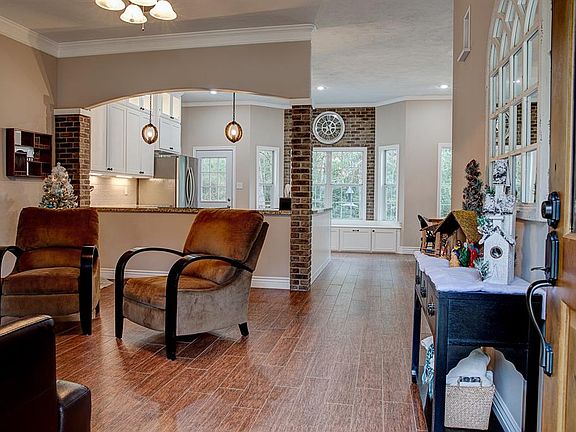 As you enter the main house, you can see the floods of light and open concept living. No detail has been spared with the wood look tile floors throughout and lots warmth in this home.