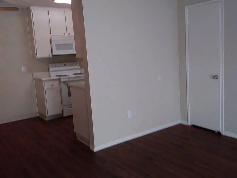 Front entry into living room at Teton Piines Apartments in Escondido, California.