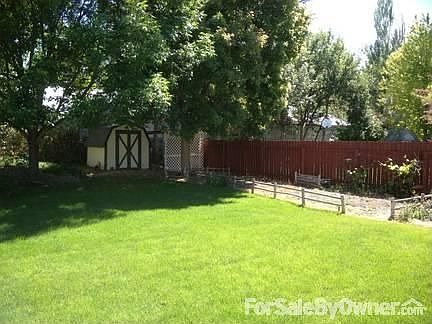 Large garden area and storage shed!
						:
						Grapes growing, but the rest of the garden is ready to be planted