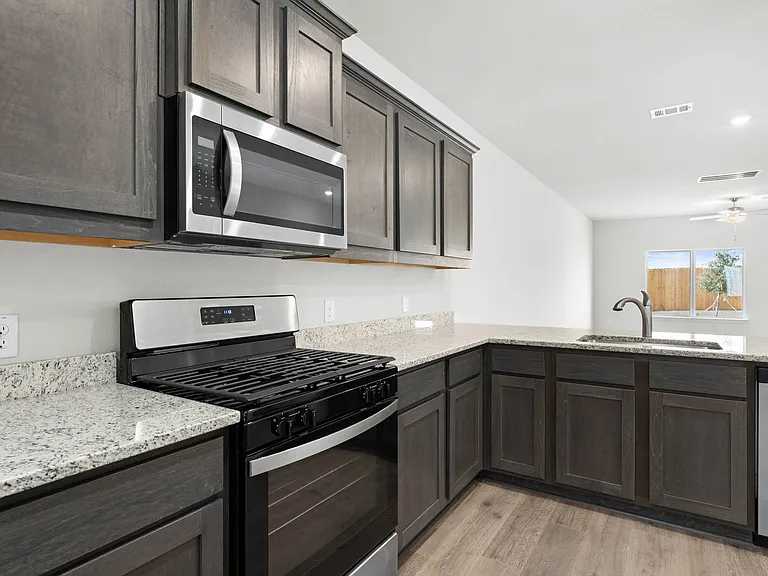 The kitchen has stainless-steel appliances.