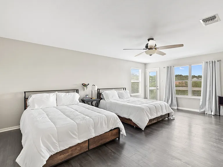 Upstairs bedroom 1= two queen beds + access to upper deck