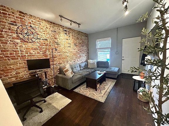 Large enough for L shaped couch and desk area.