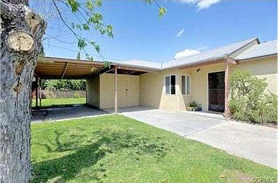 Can easily park a couple cars here and perhaps park under covere