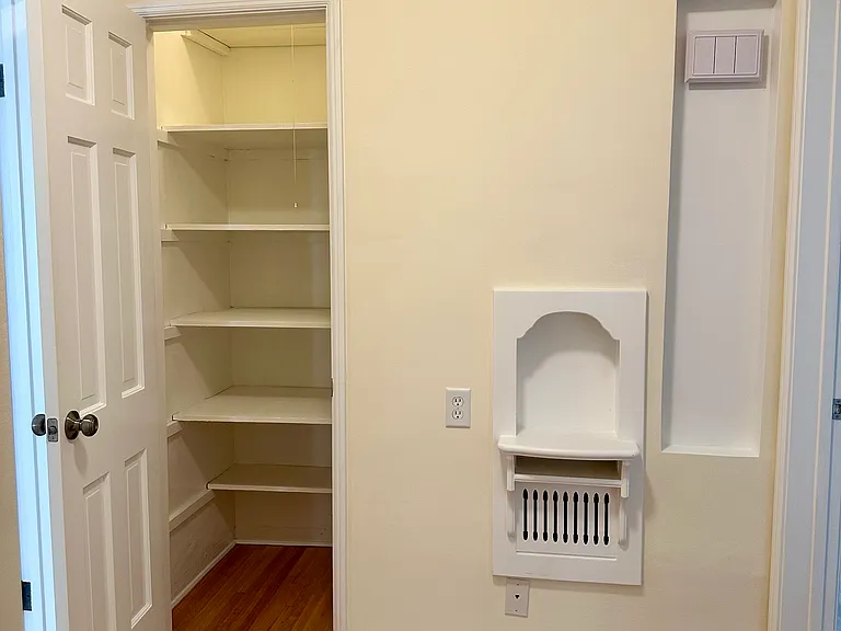 Hallway with a vintage charm, little shelf, closet space