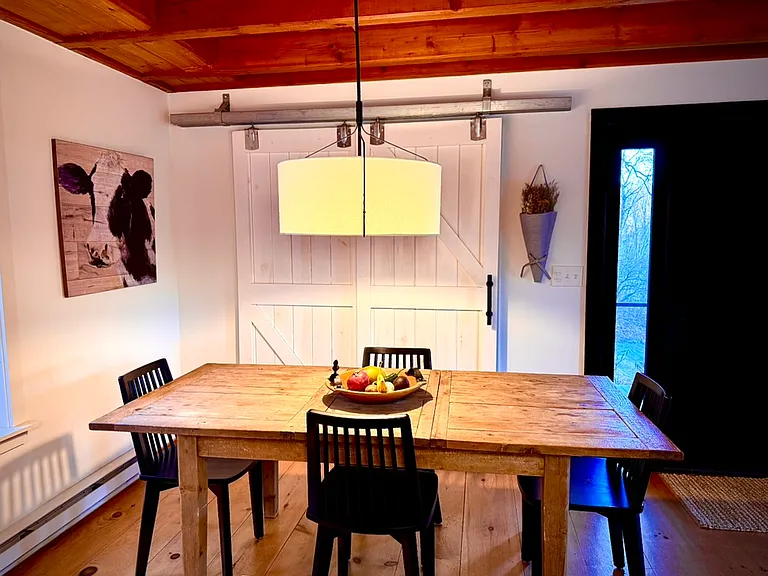 Kitchen breakfast table and pantry with barn doors