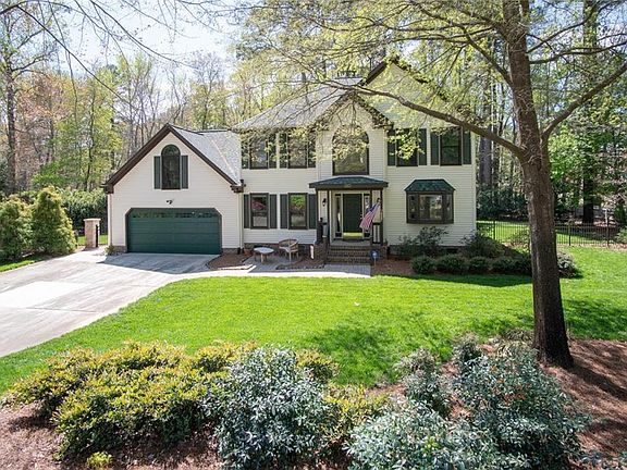 Decorative fencing and lush landscaping complete this picture.
