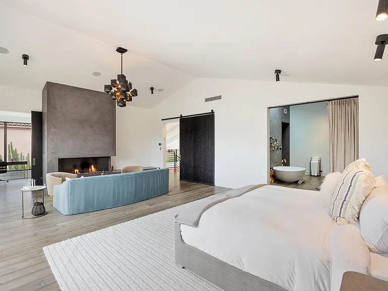 Enjoy your morning brew on the deck or in front of the fireplace
The Master suite flaunts a balcony, desk corner, private lounge, en-suite bathroom and more!