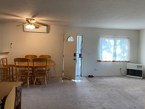 Front entry into living room/ dining area with monitor heater and new Mini-split.
