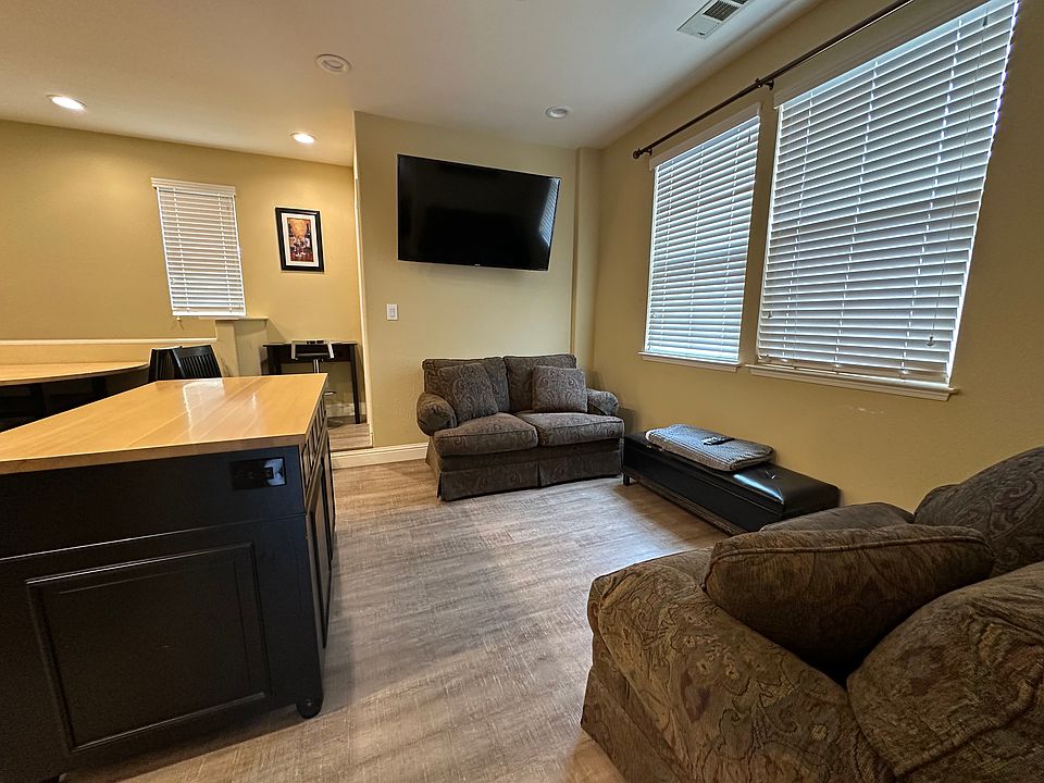 moveable island and living room area, smartTV with AppleTV and use of many streaming apps and digital antenna for local channels (no cable)
