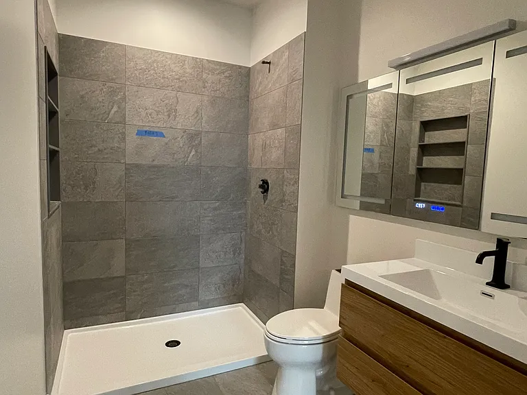 Bathroom 2. Has a large linen closet (not shown).