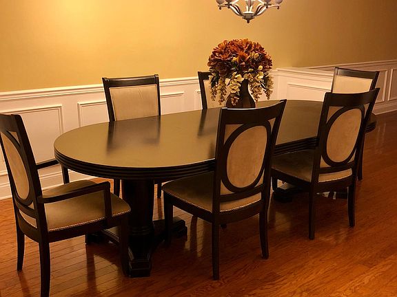 Dining Room with wainscoting and crown molding 