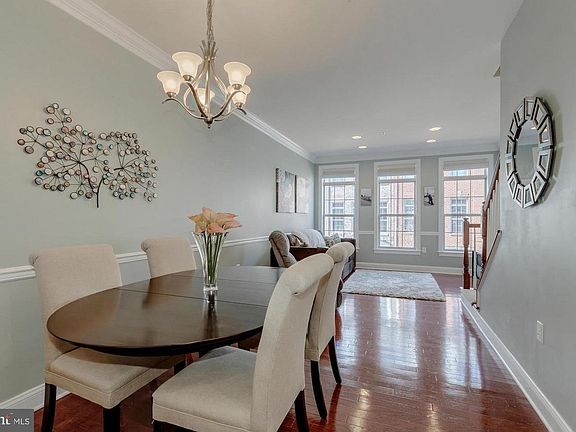 Large dinning room and living room with custom blinds throughout
