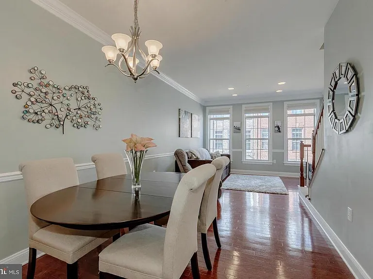 Large dinning room and living room with custom blinds throughout