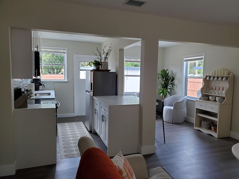 Entry upon walking into the home. Open concept kitchen with sitting area and living room.