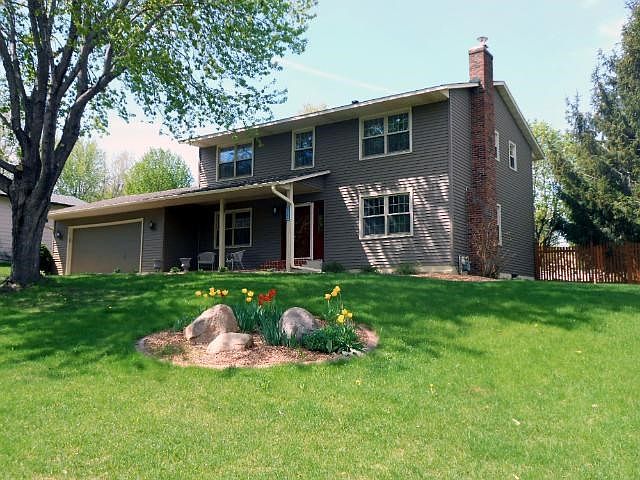 This is not your typical two story!  Welcoming from the moment you drive in the driveway.  Mature trees shade the house, beautiful landscaping accents the walkway and you have a custom brick front porch, just perfect for relaxing.