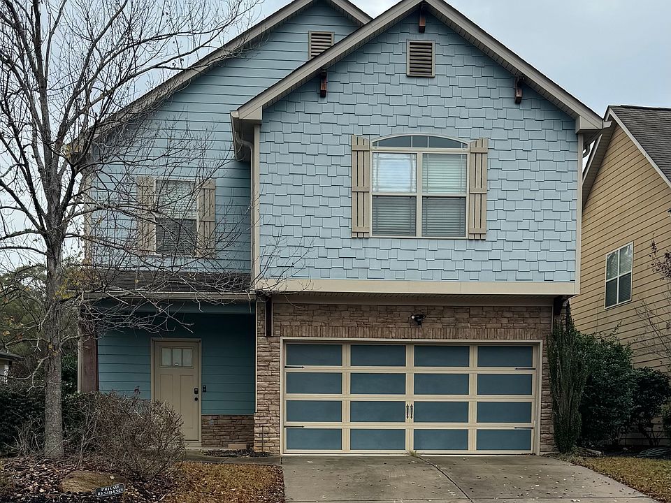 Front of house, 2 car garage.