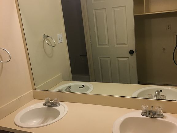 His & hers double vanity with lots of cabinet space.