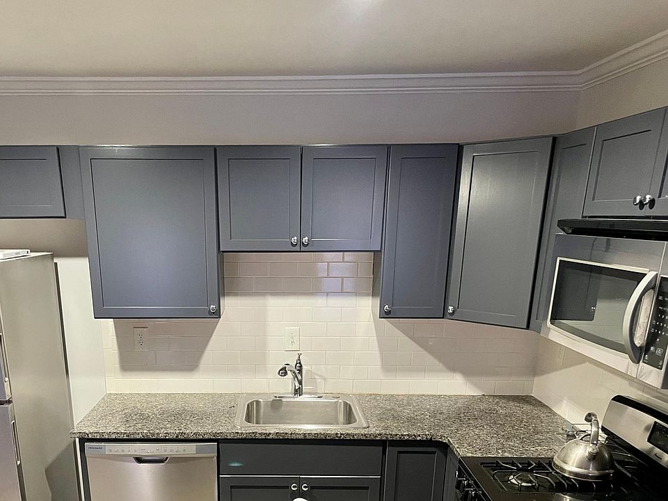 Fully-equipped kitchen boasts stainless appliances and lots of cabinet space