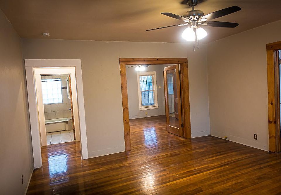 Living room looking into bedroom and bath.