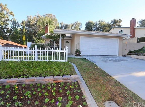 Room for several cars in the driveway. 30 year liquid stucco paint and new gutters to keep the exterior looking fresh for years to come.