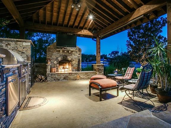 Decked out cabana with outdoor kitchen, Lynx Pro Series Grill with double side burner, granite counters, full size fridge. Gorgeous rock fireplace with gas starter. Flat screen TV and Surround sound.